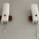 Mid-century wall lights in white plexiglass with a wooden base, 1960s, Germany.