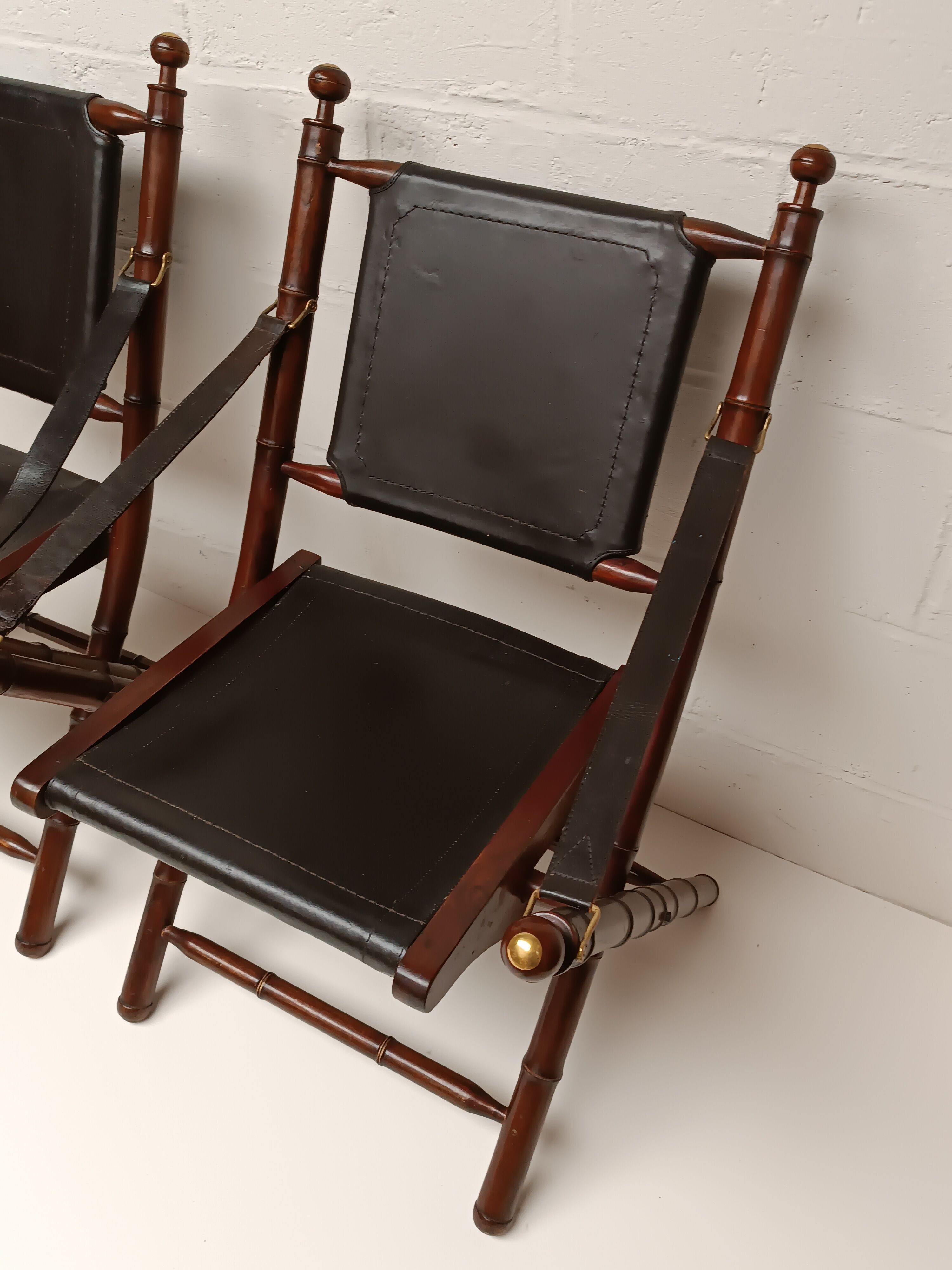 Pair of vintage "safari" folding armchairs in mahogany and leather