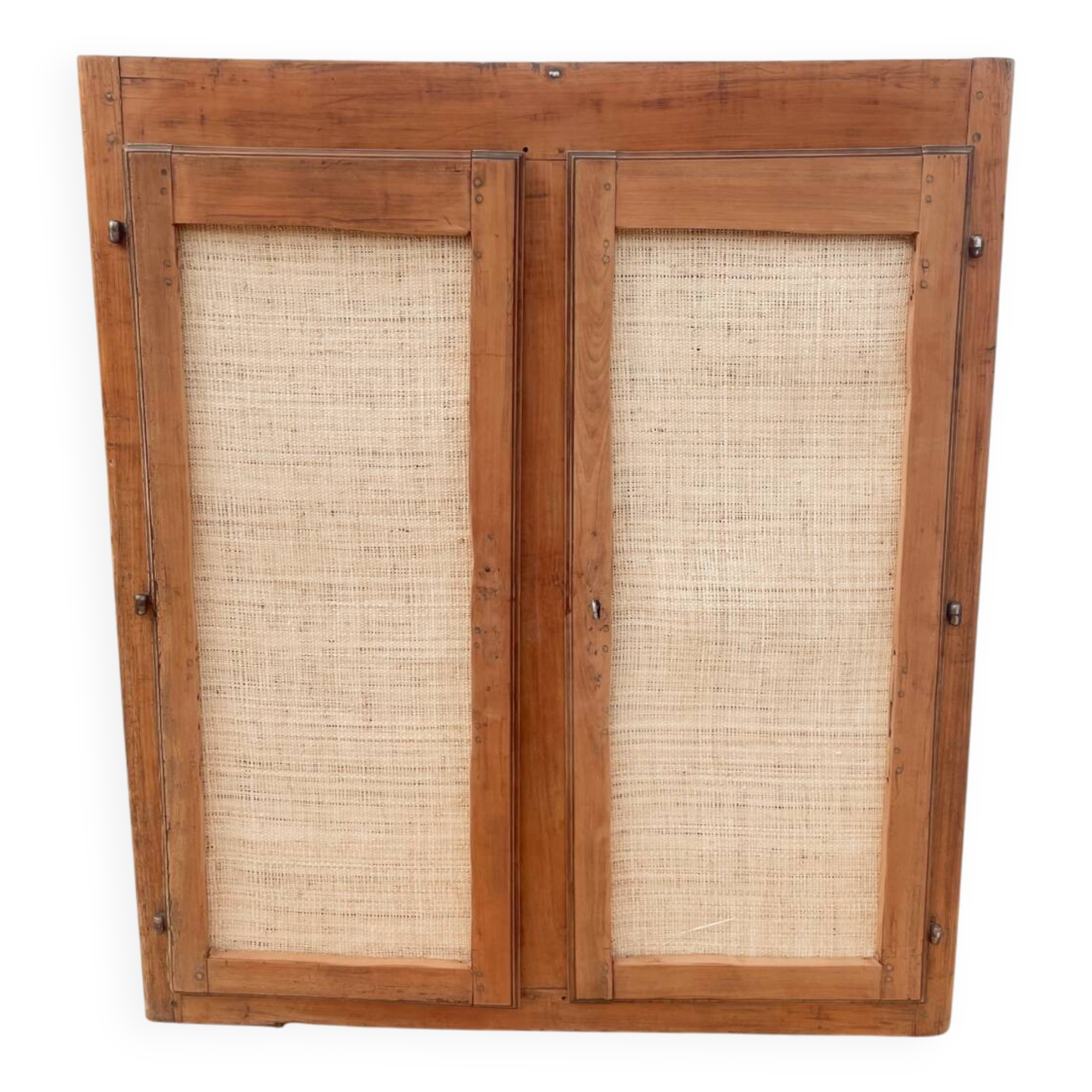 Low cabinet in raw wood and woven raffia.