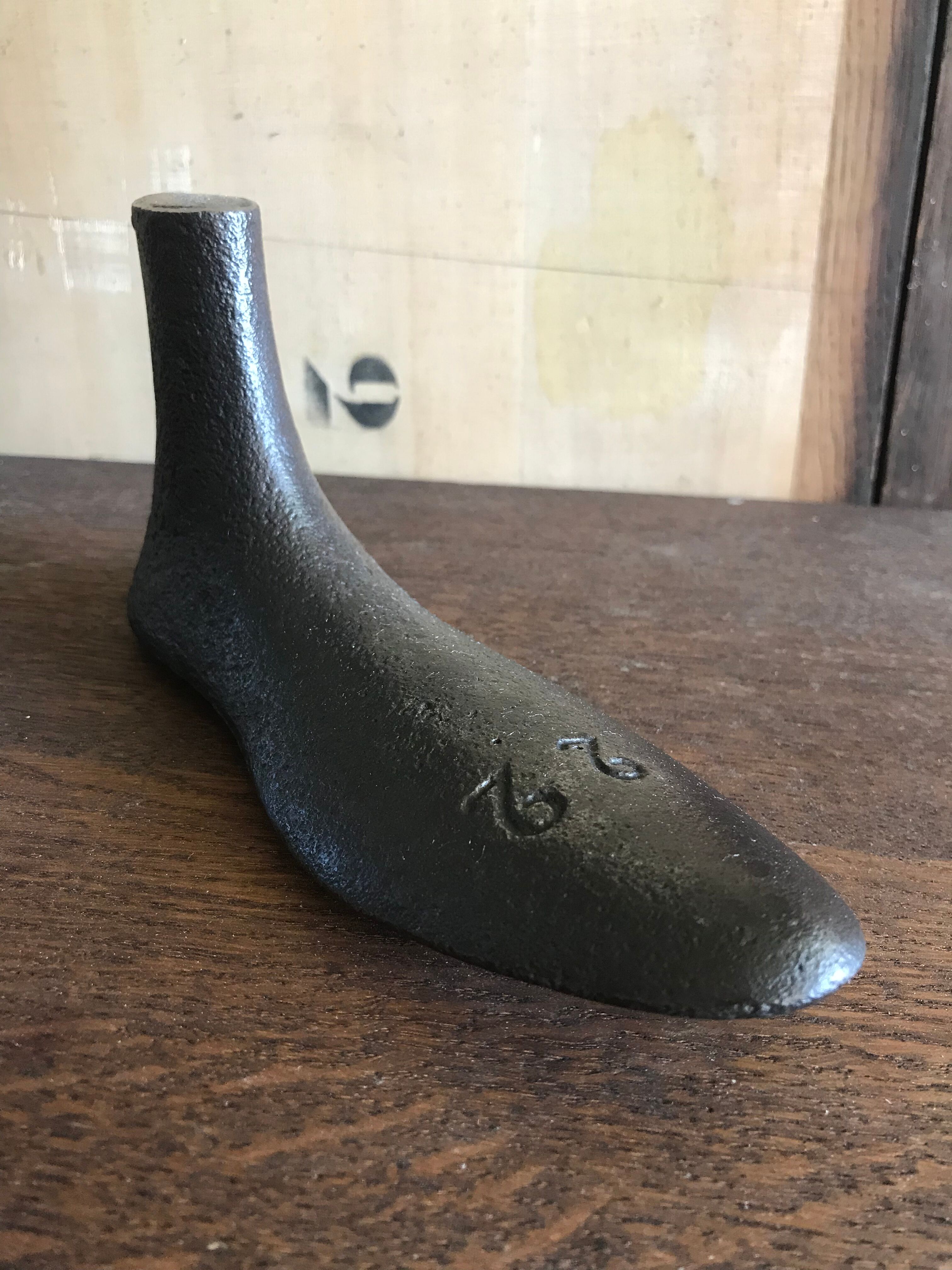 Foot shape vintage metal shoemaker