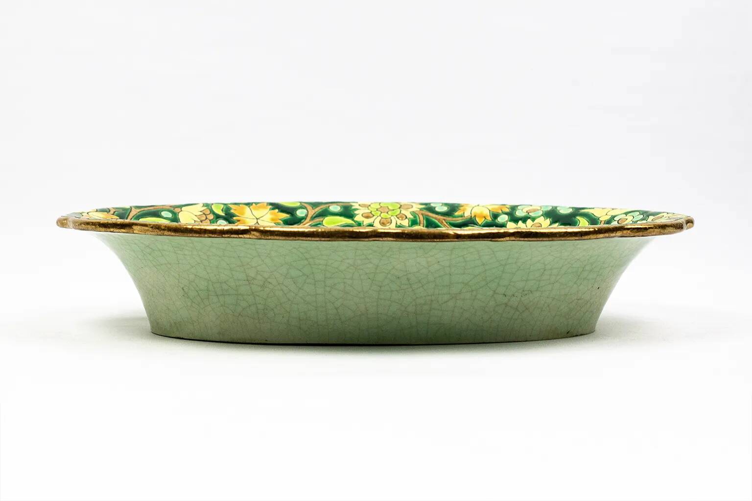 Longwy cup in cloisonné enamels on a green background, polychrome floral decoration and gold