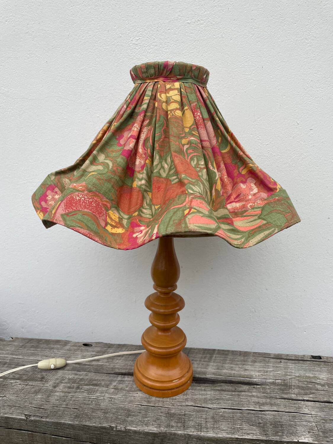 Turned wood lamp with flower shade