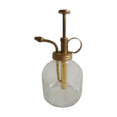 Transparent glass spray and gold metal