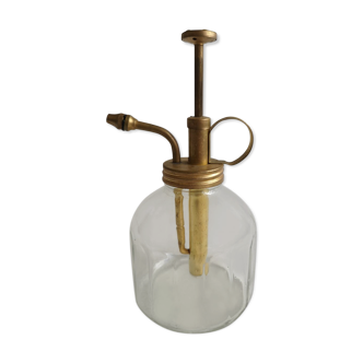 Transparent glass spray and gold metal