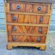 Small English chest of drawers with a folding top.