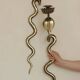 Pair of Neo-Egyptian Style Engraved Brass Wall Sconces Featuring Cobras