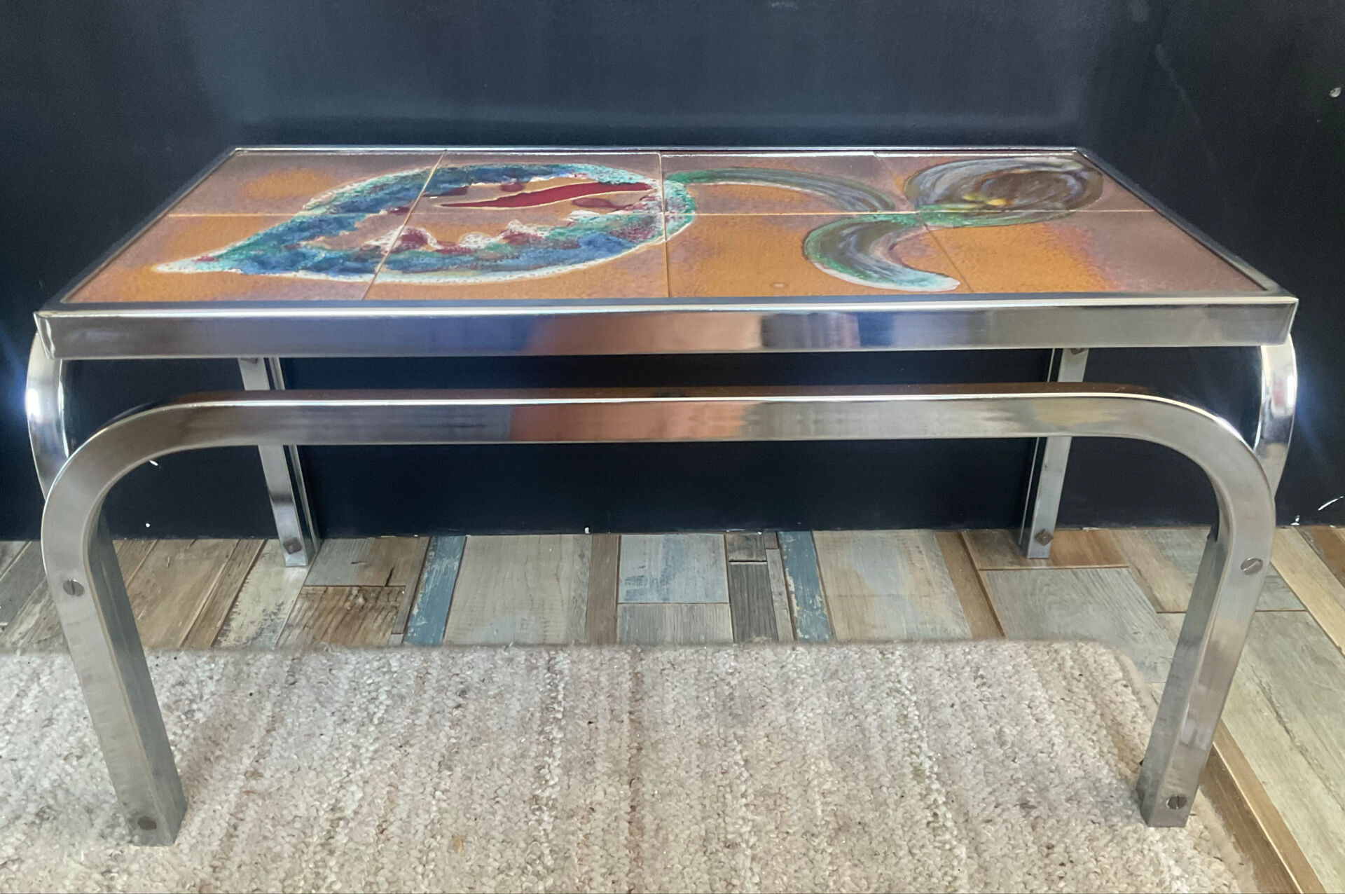 Vintage coffee table in stainless steel and ceramic from the 1970s.