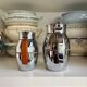 2 Hermès insulated jugs in chrome metal and covered leather.