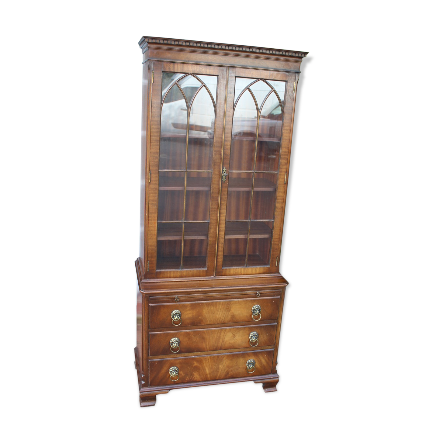 Mahogany bookcase with brushing slide
