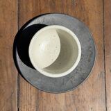 White Indonesian ceramic cup and gray saucer