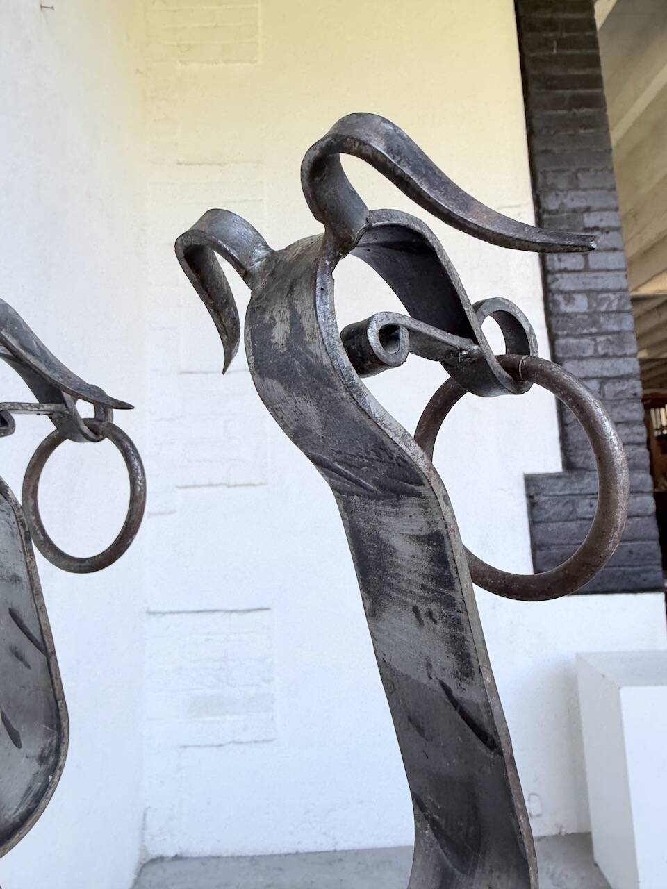 Pair of zoomorphic metal andirons "dogs" 1950