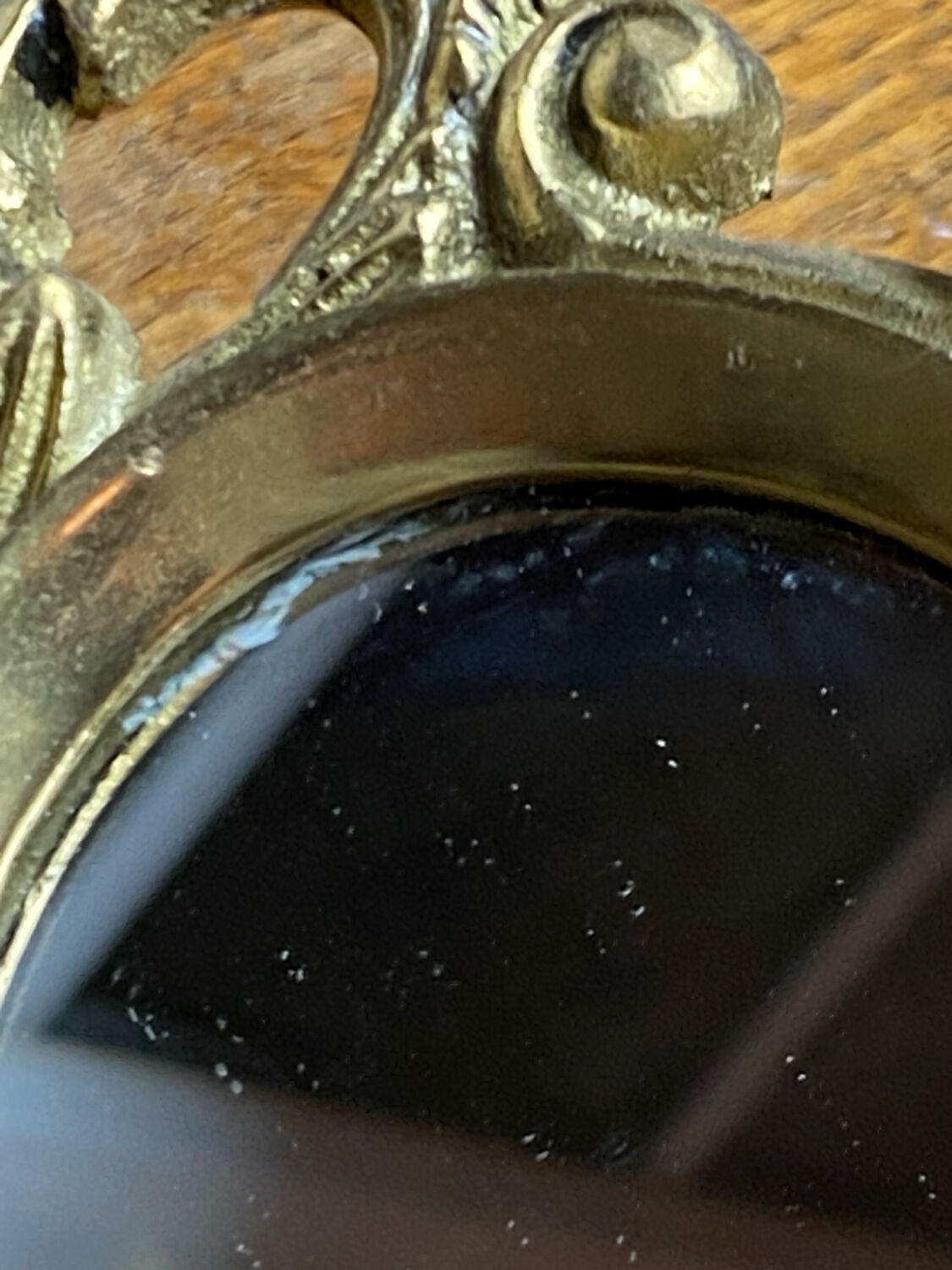 Small antique bronze mirror