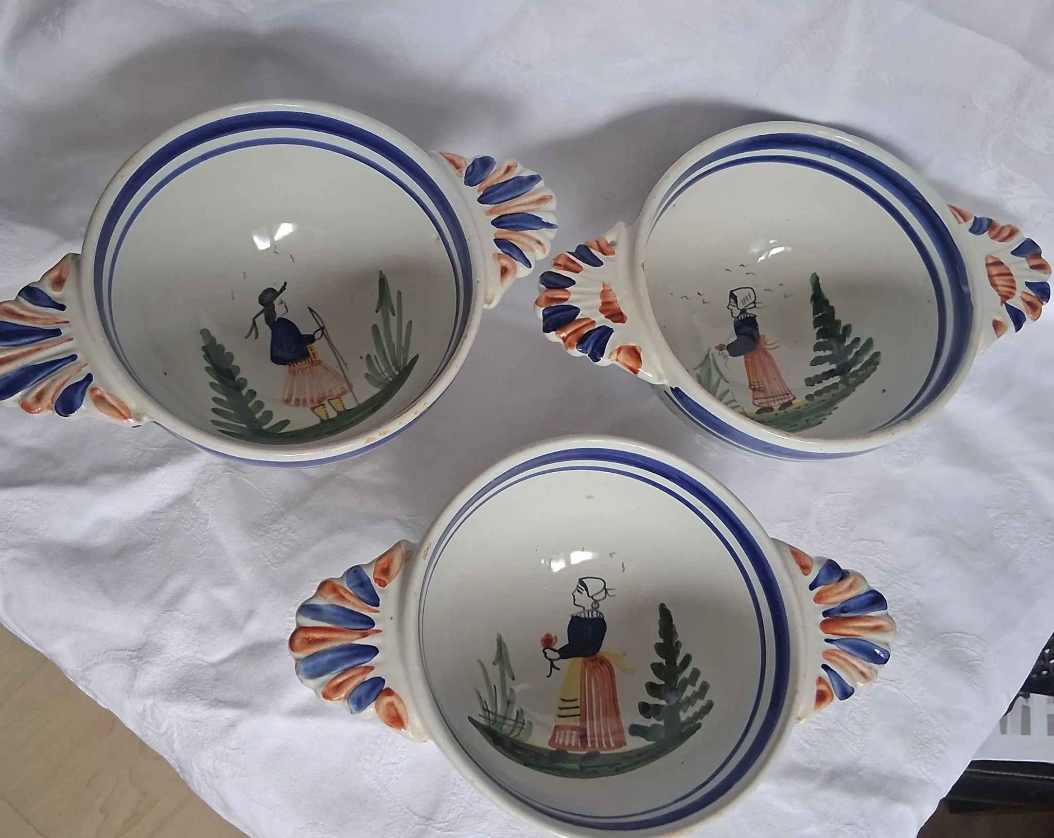 Set of three antique earthenware bowls from HB Quimper, signed.
