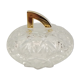 Round crystal box and a golden metal handle