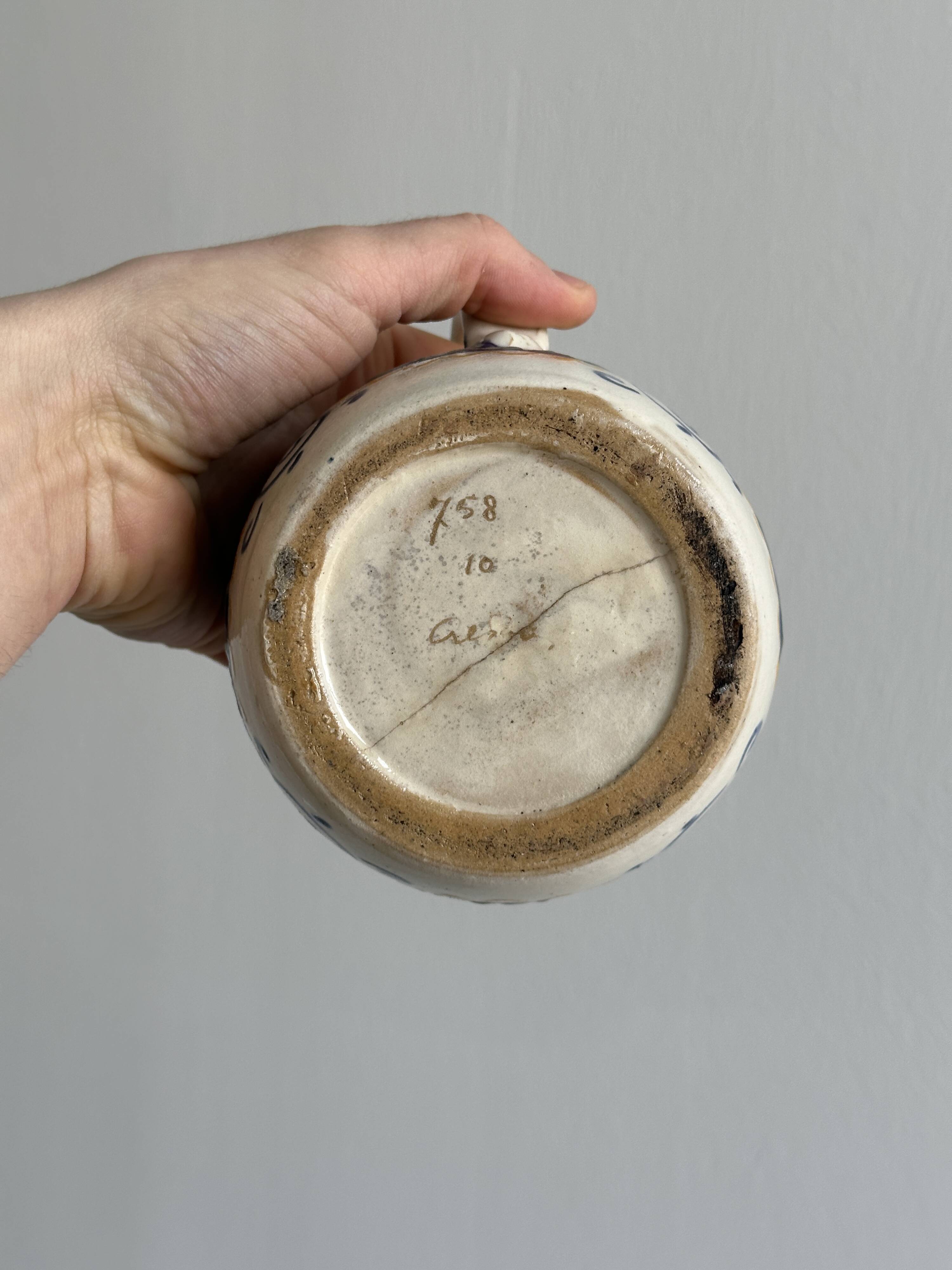 Hand painted ceramic decorative pitcher