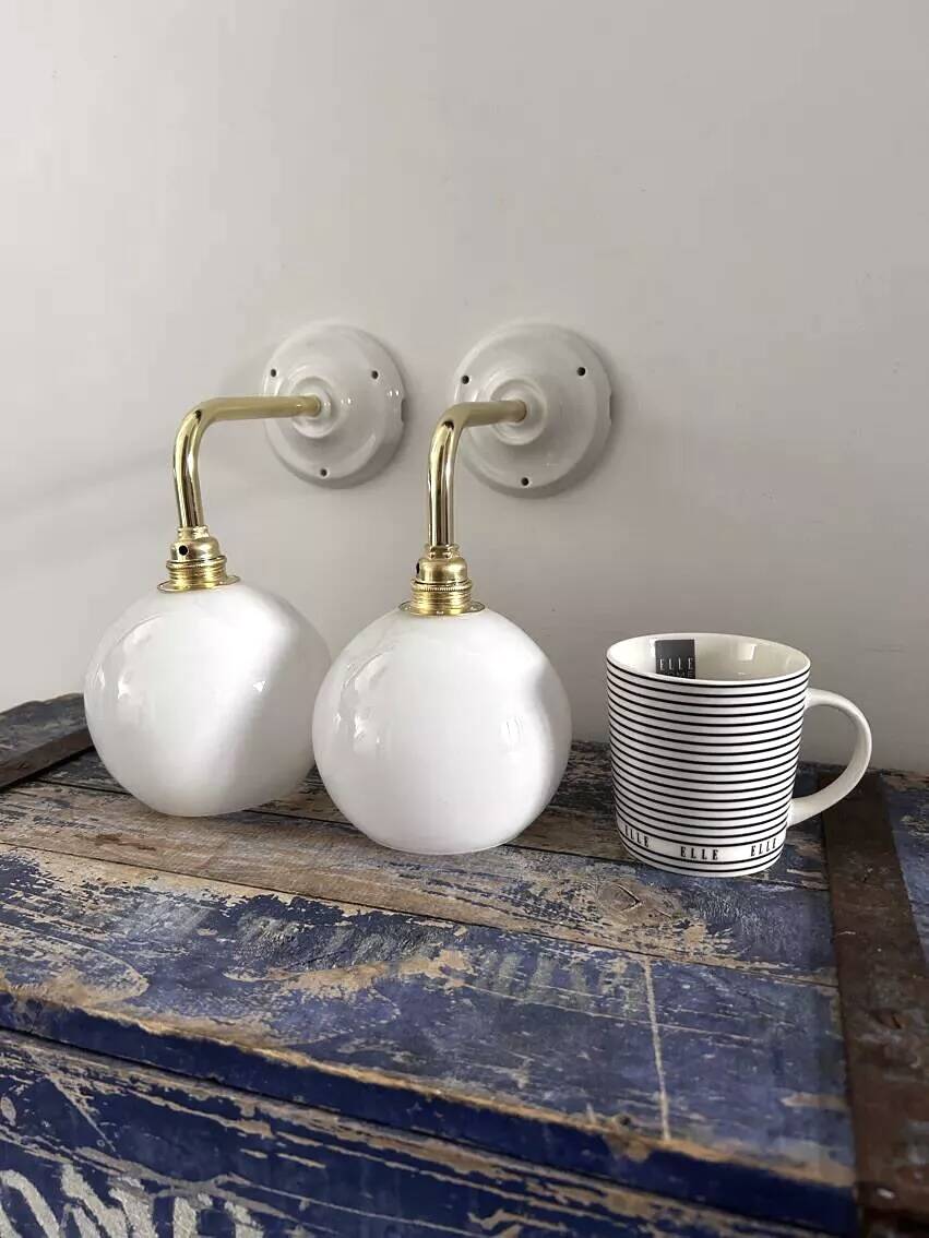 Pair of white opaline sconces