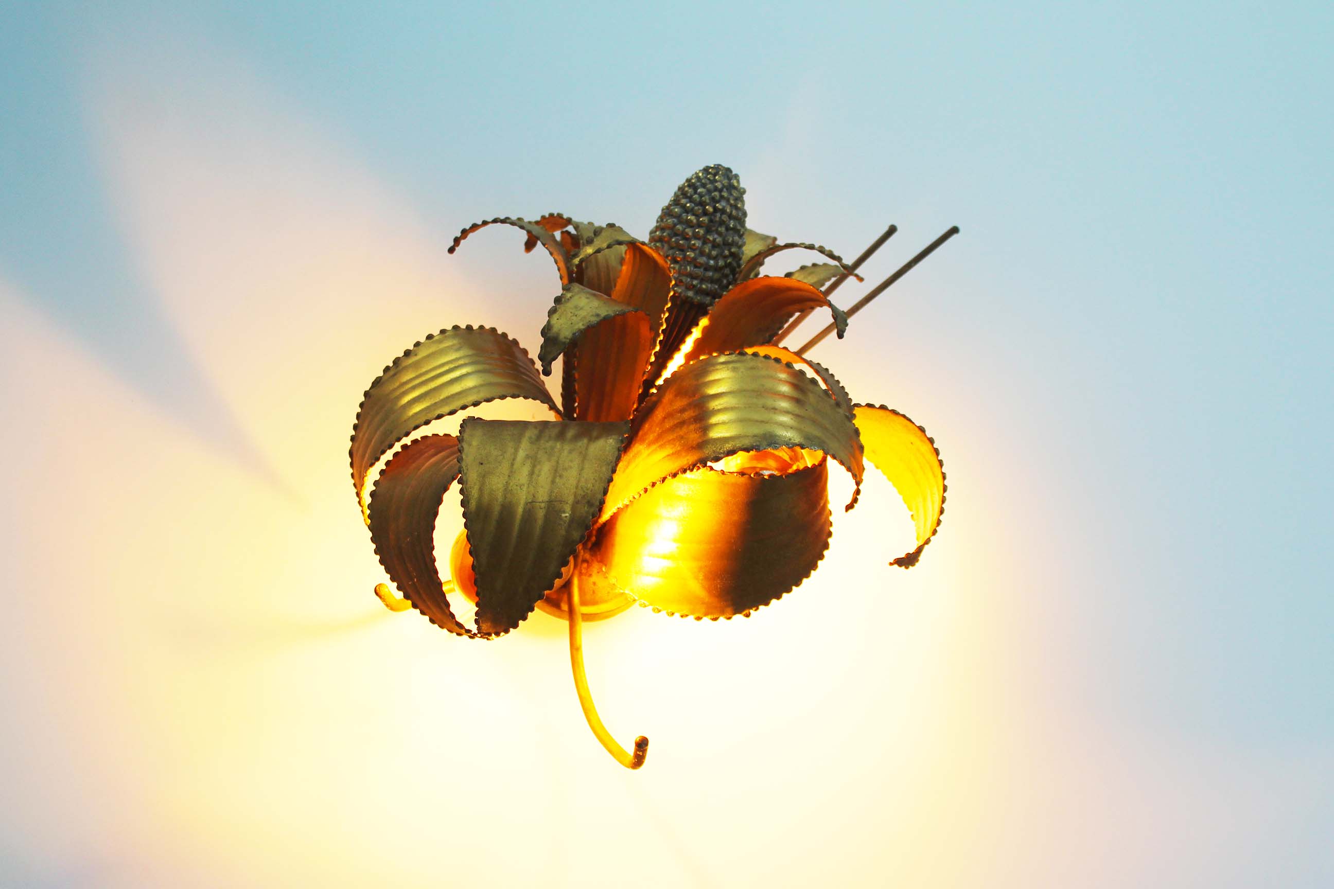 Brass torch cut 'corn cob' wall lamp