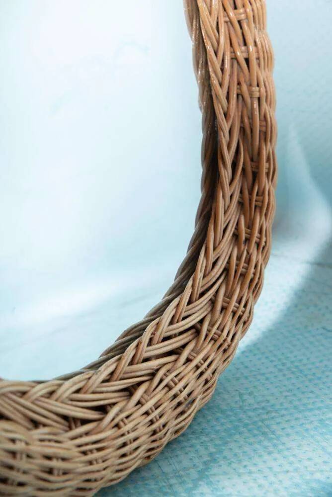 Vintage 70s bohemian wall mirror in woven rattan.