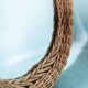 Vintage 70s bohemian wall mirror in woven rattan.