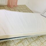 Old white metal and brass bed