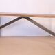 Old bench in Burmese teak with a wrought iron base.