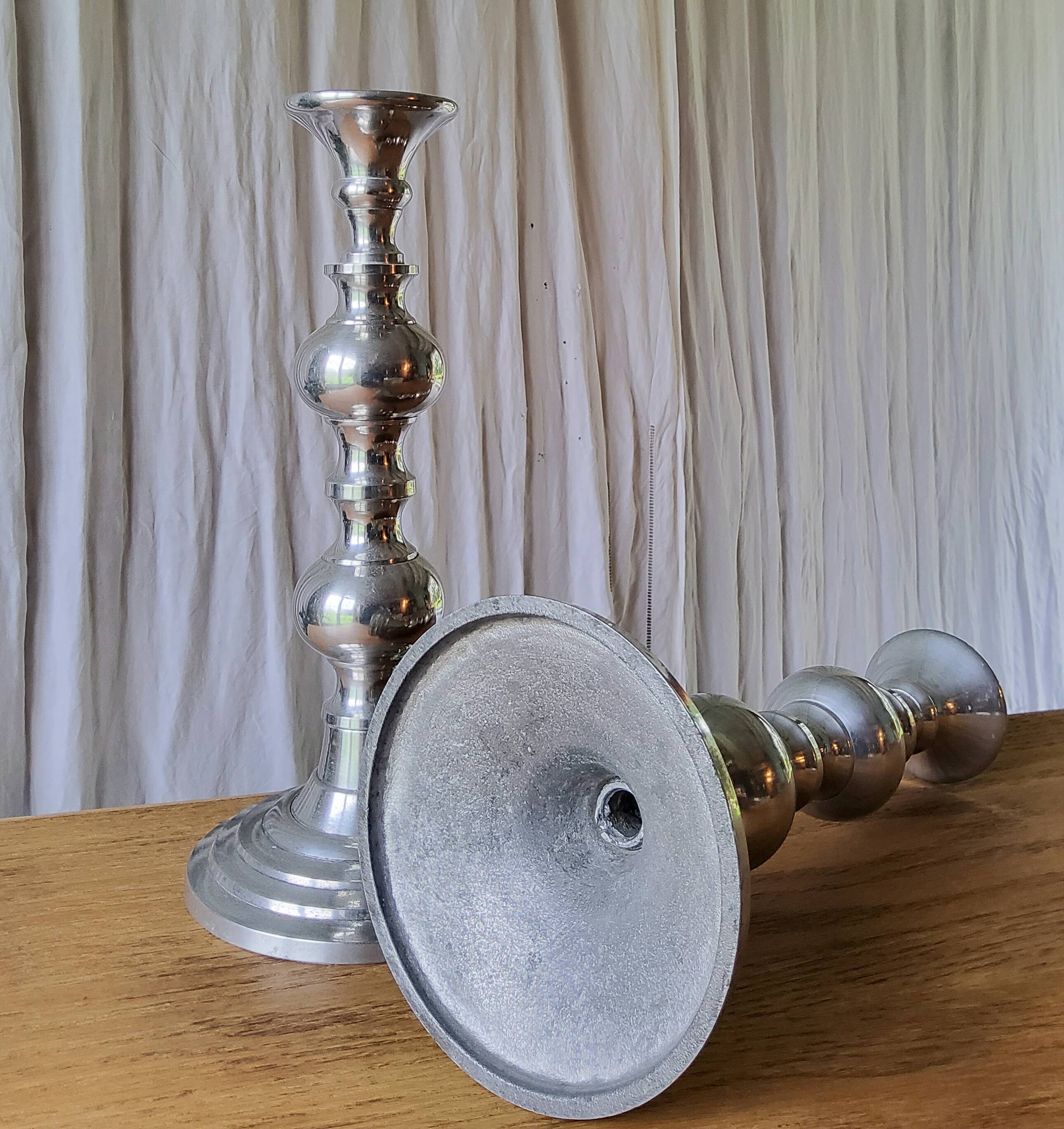 Pair of antique chrome metal candlesticks