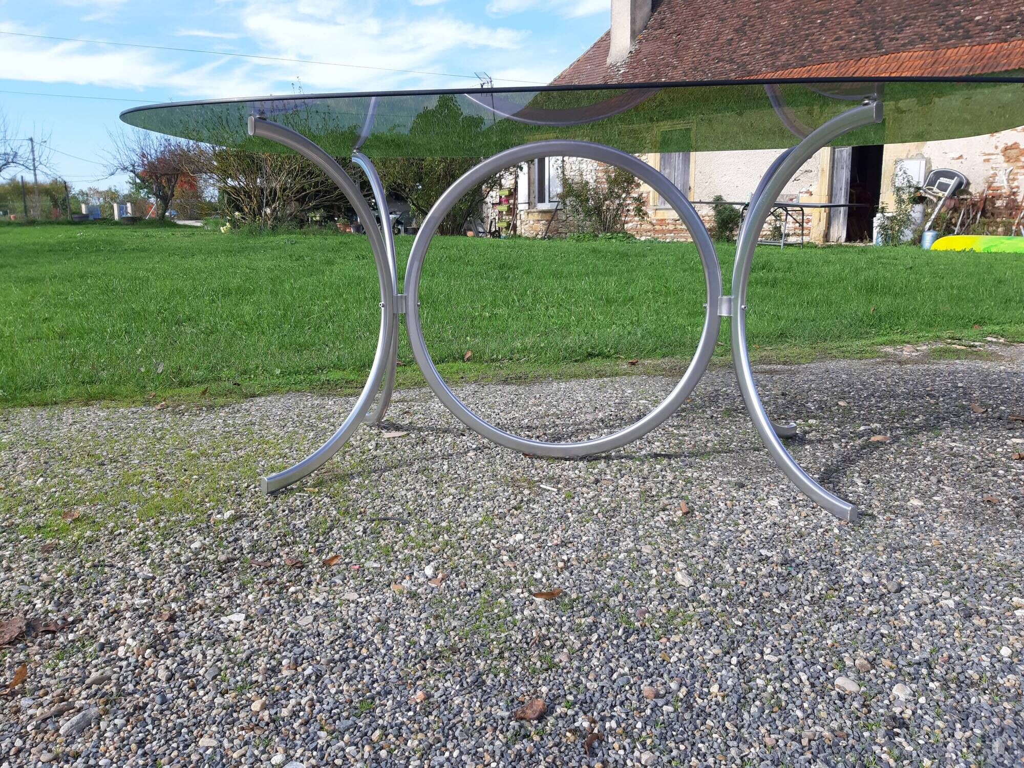 Vintage table of the 70s in chrome and smoked glass