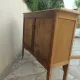 Art Deco sideboard in raw wood with a wax finish, closed by 2 glass doors.