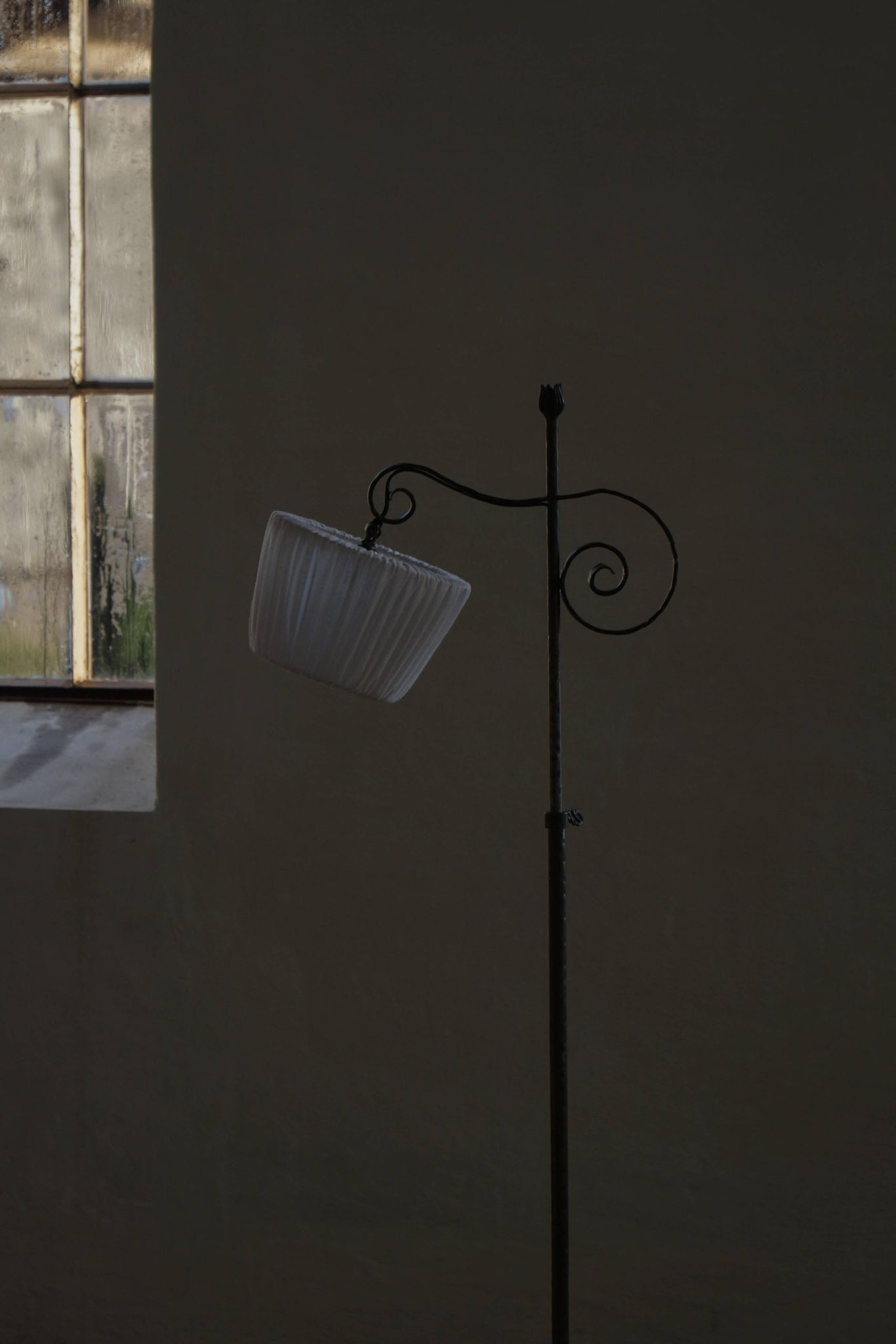 20th-century wrought iron floor lamp with swirling detail, Danish Art Deco.