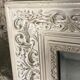 Louis XV-style mirror in wood and white stucctuc and patinated beige
