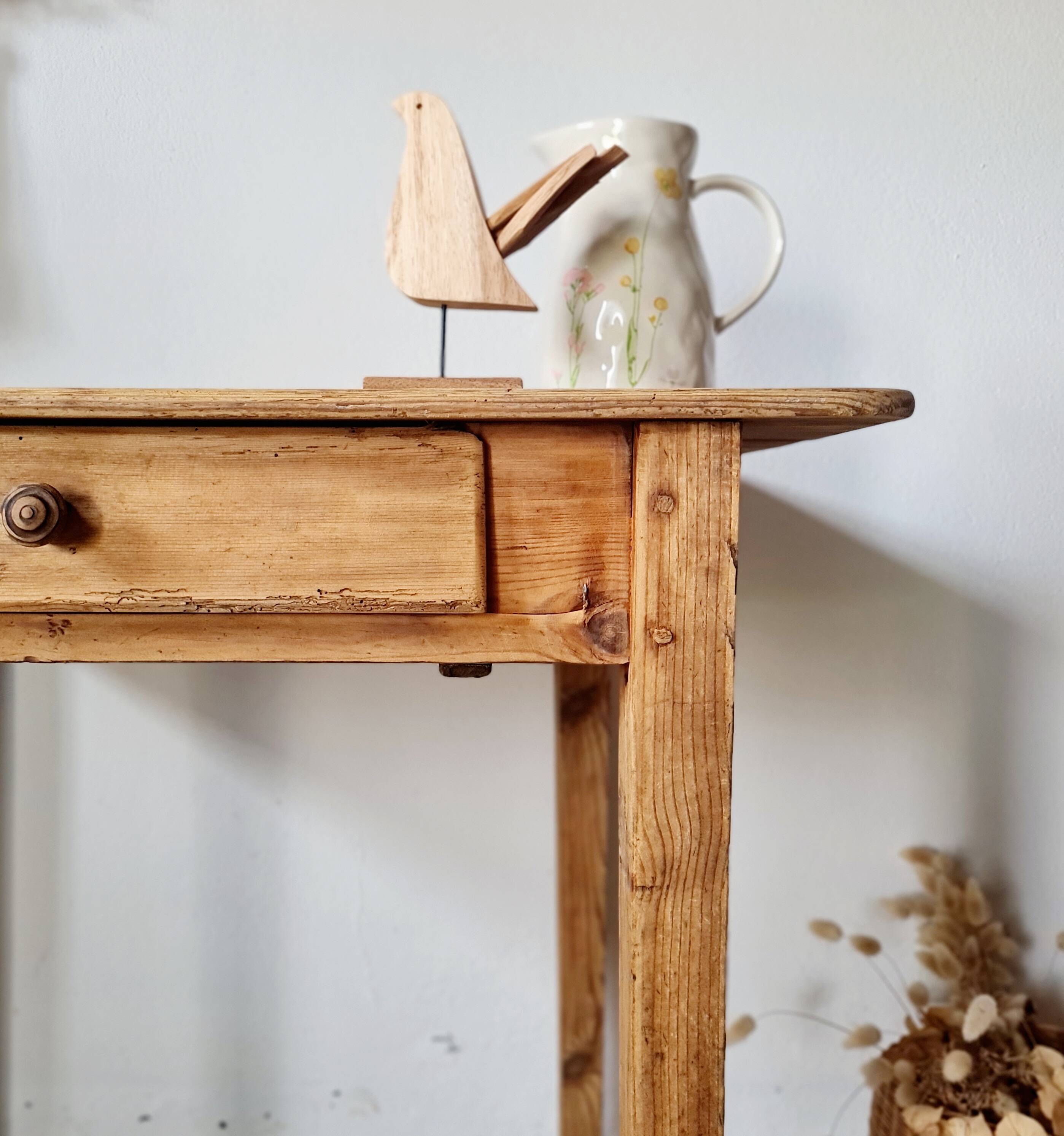 Small old farmhouse table in raw wood.