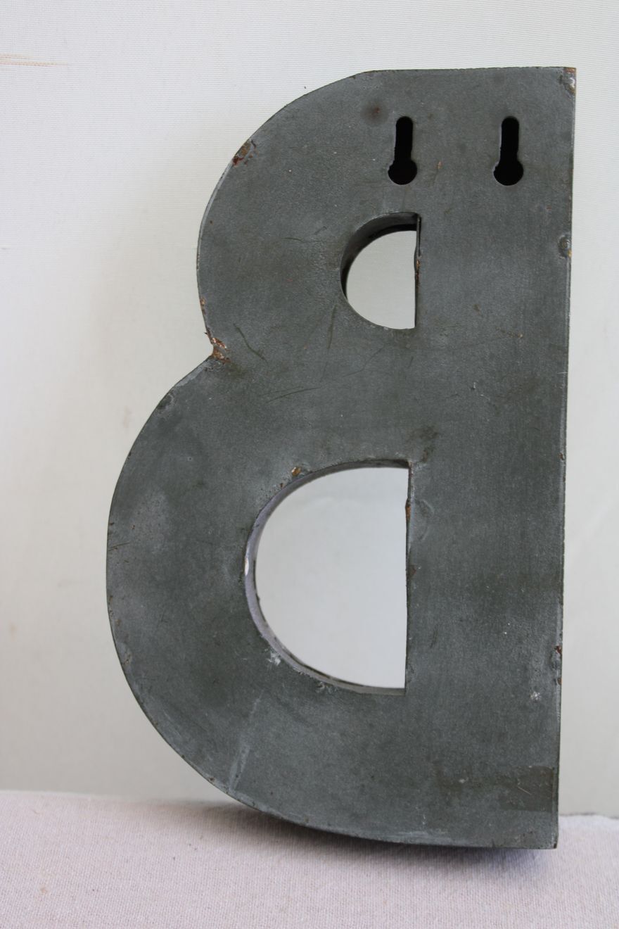 Letter of sign in zinc