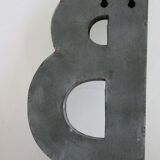 Letter of sign in zinc