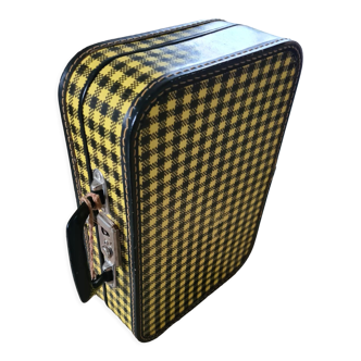 Antique suitcase in vintage yellow and black cardboard