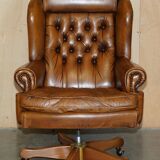 Captain's chair Chesterfield vintage leather with tufted wingback.