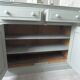 Antique sideboard enhanced in verdigris, wooden top.
