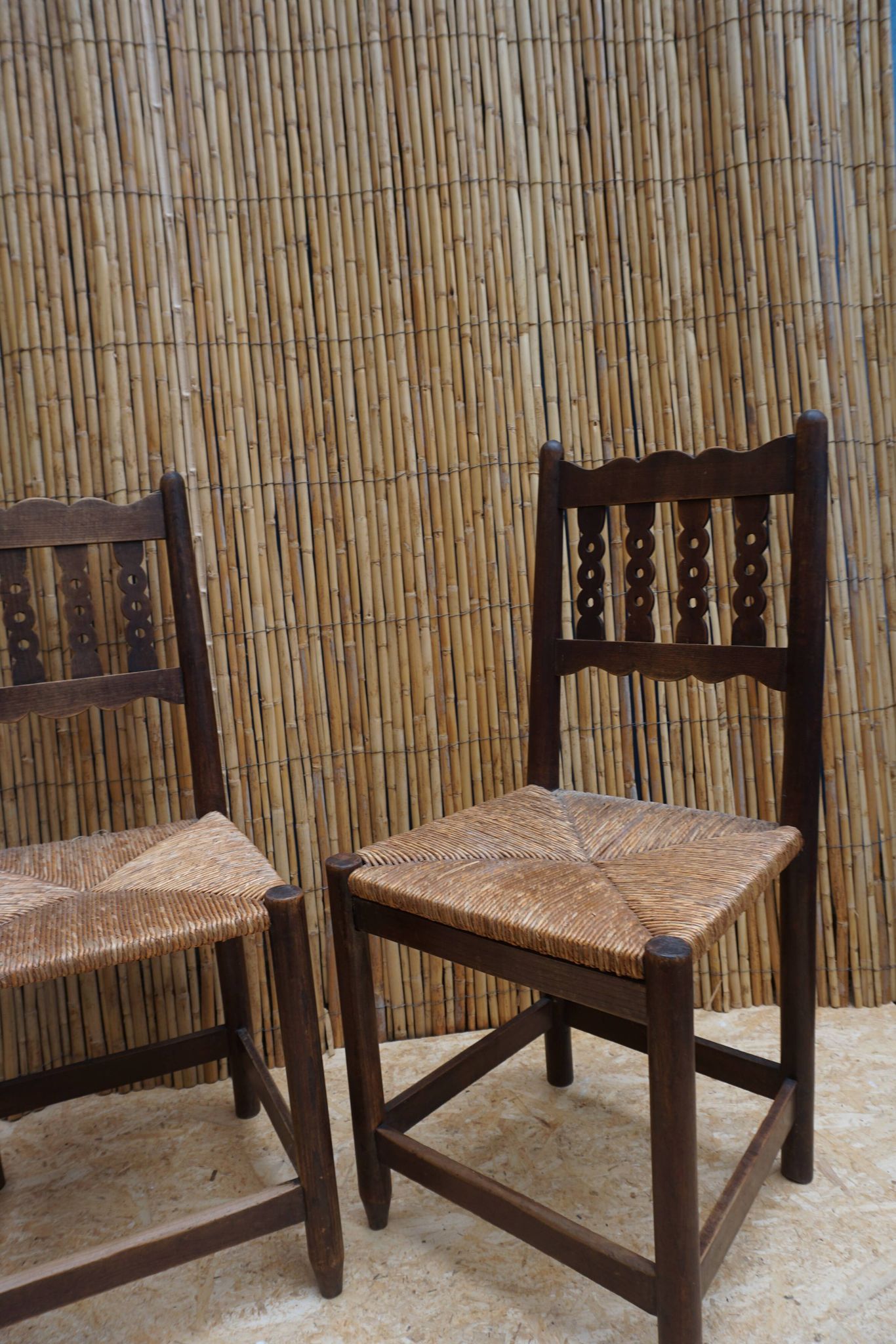Pair of antique straw-seated farm chairs