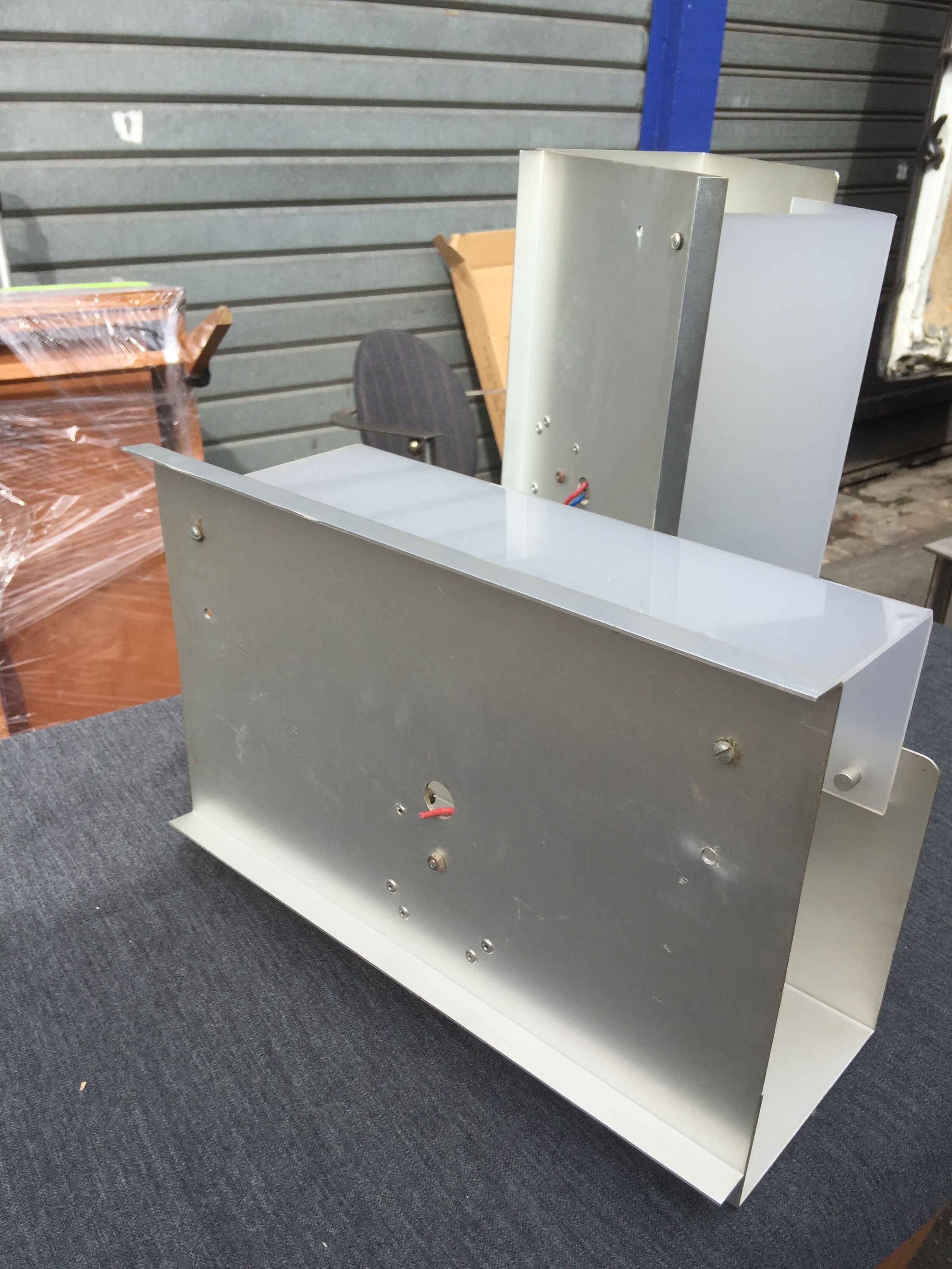 Pair of aluminum and translucent rodohide sconces 1970