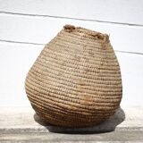 Old basket, burgundy straw and bramble, woven basket, interior decoration, pantry, flowerpot