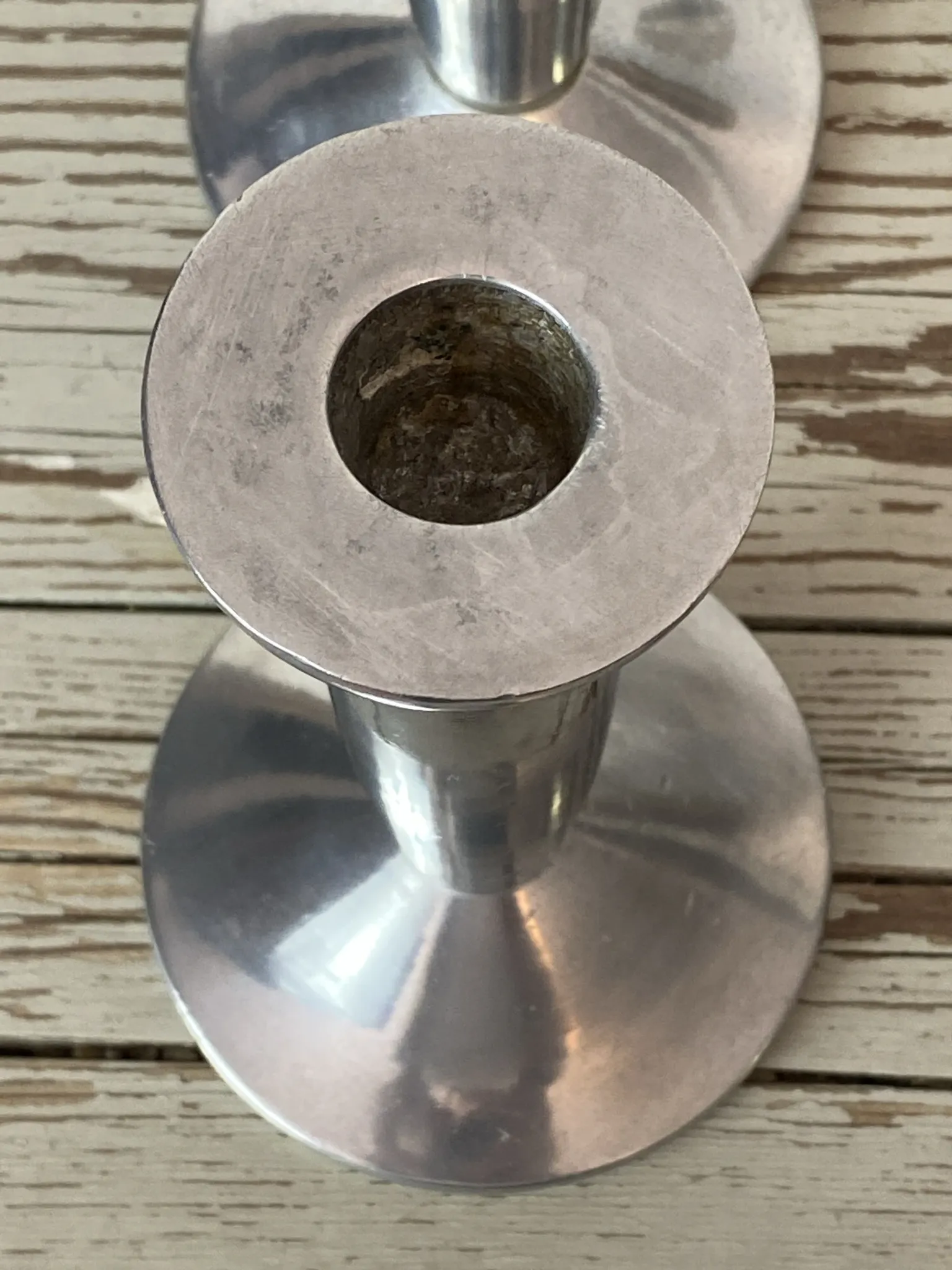 Pair of minimalist polished aluminium candle holders