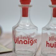 Oil and vinegar with red writing