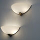 Pair of Art Deco wall sconces in brass and perspex.