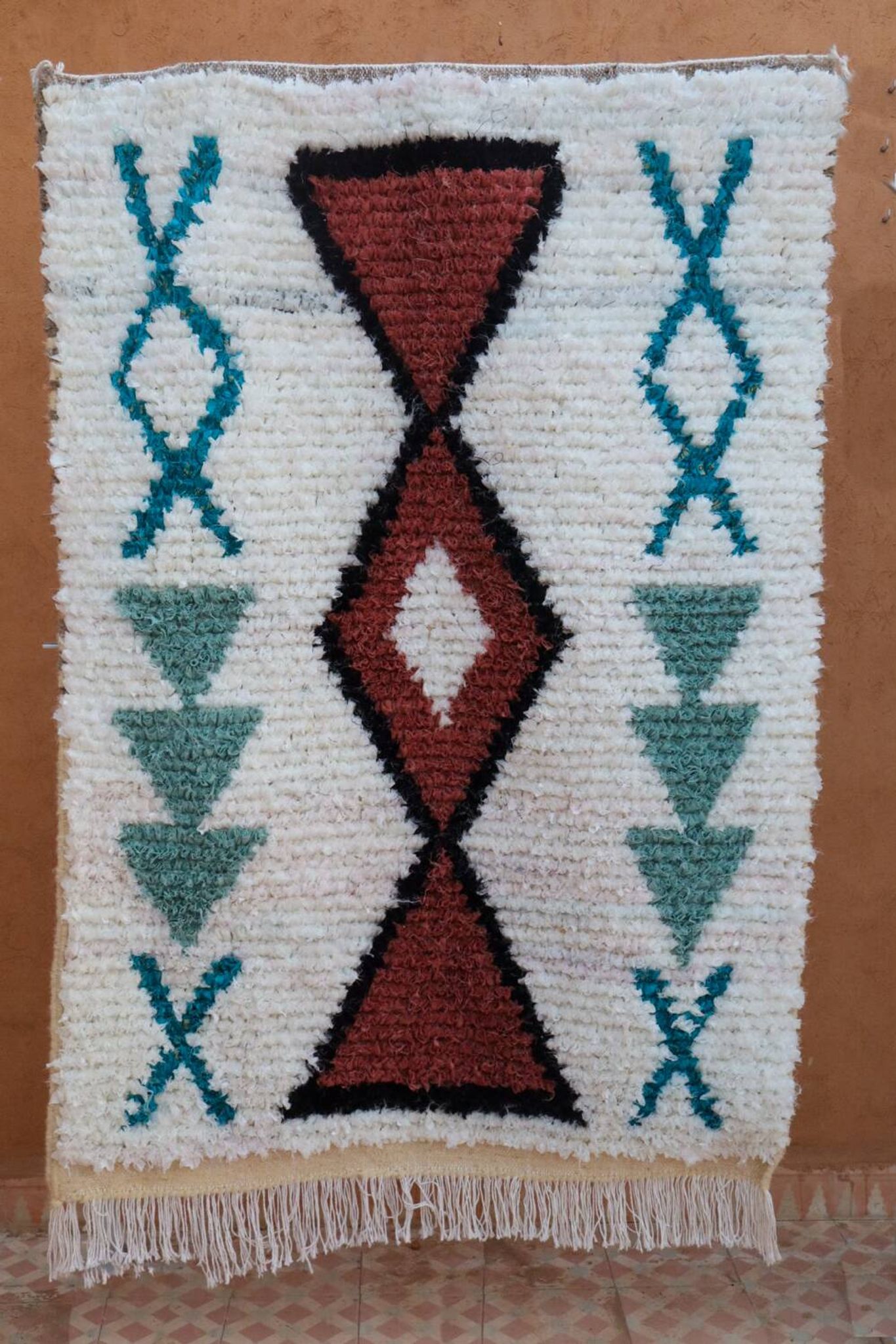 White Moroccan Boucherouite Berber rug with colorful patterns