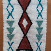 White Moroccan Boucherouite Berber rug with colorful patterns