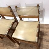 Pair of Maison Regain leather chairs