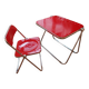 Vintage lot design – Platone table + red Plia chairs – Anonima Castelli