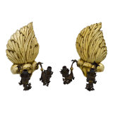 Pair of Hollywood Regency sconces in carved, painted and patinated wood, 1950s