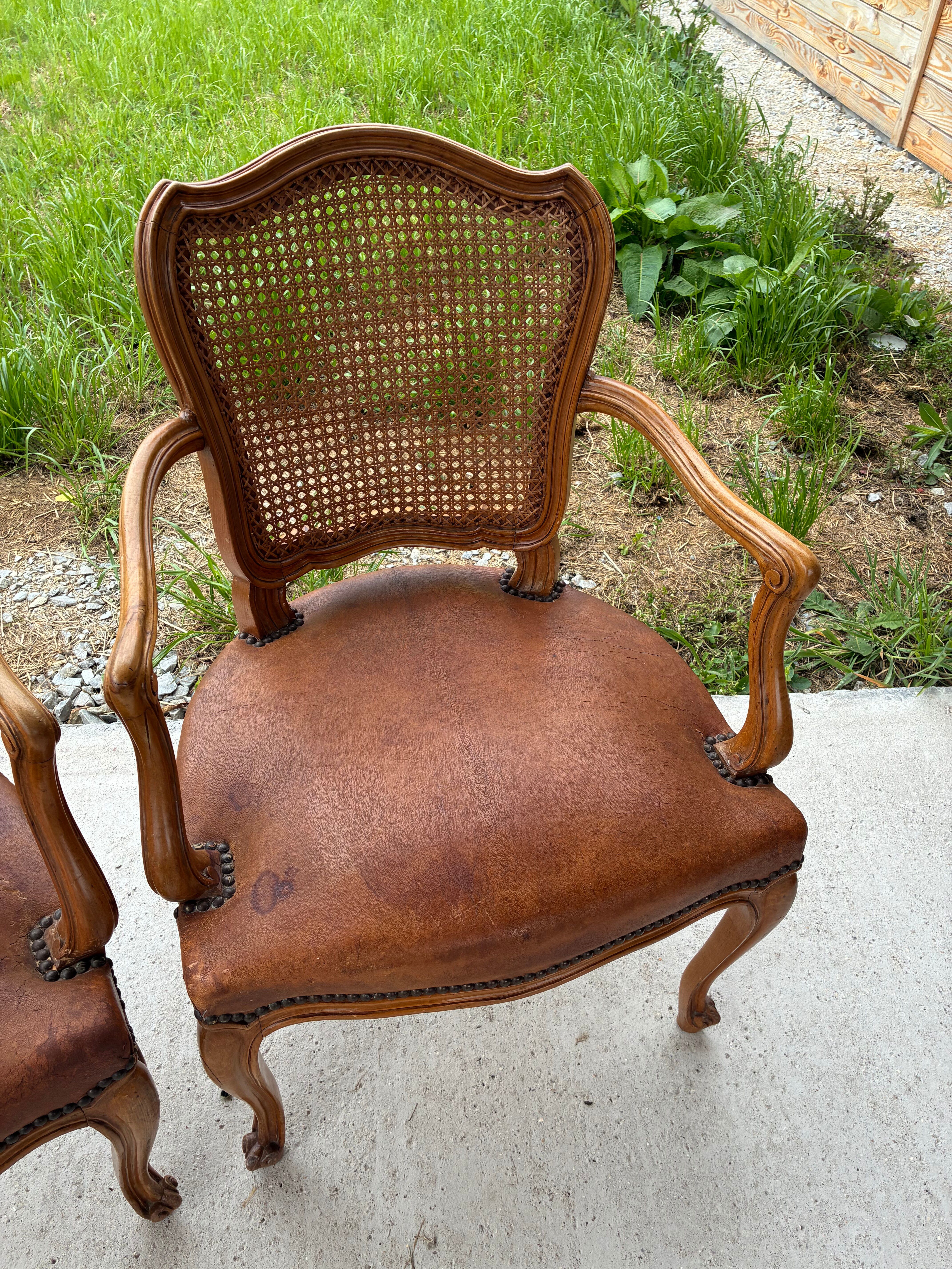 Cane and leather armchair in Louis XV style