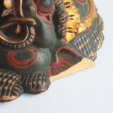 Two polychrome painted and gold leaf gilded Barong dance masks from Bali, Indonesia.