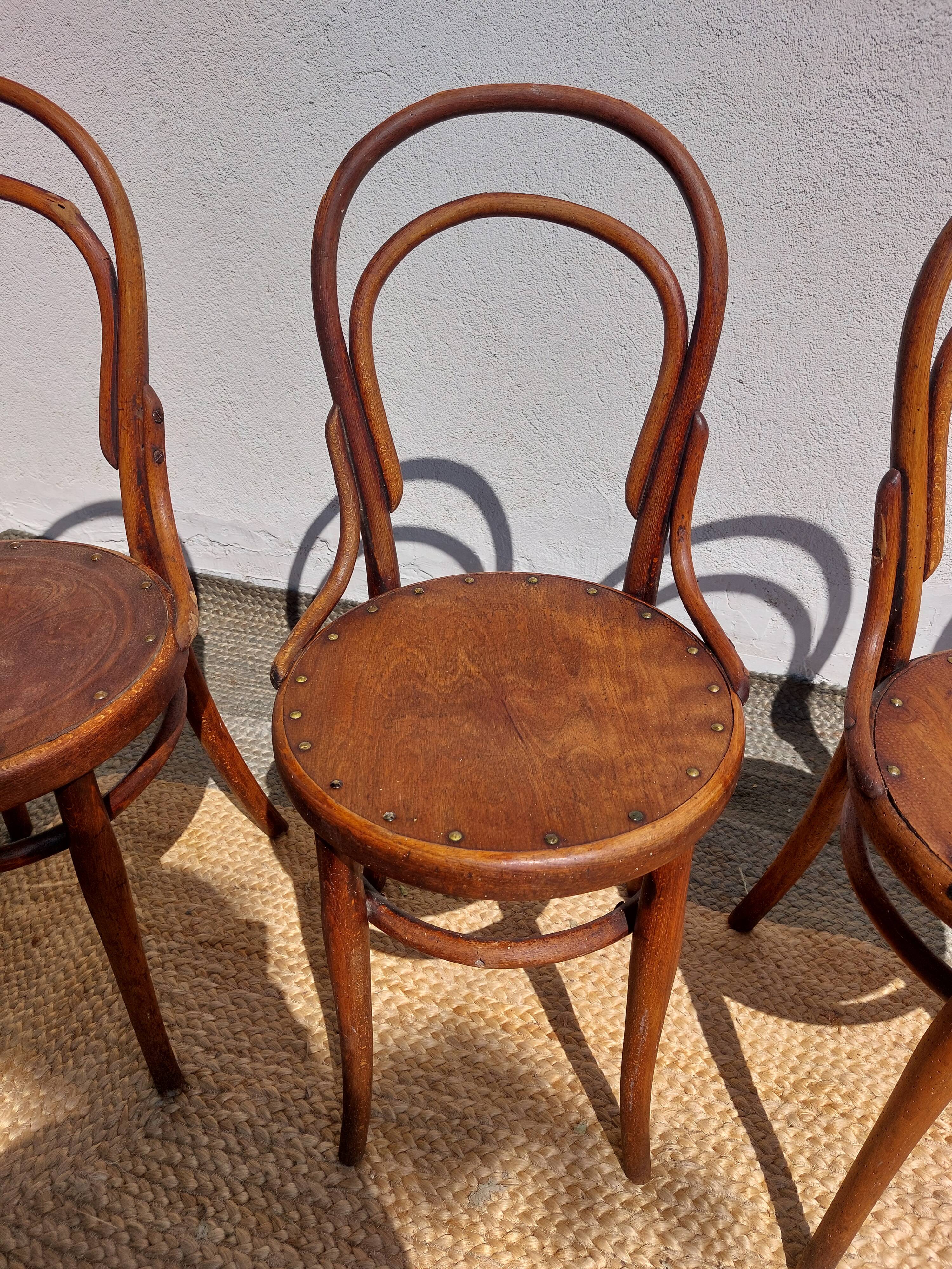 4 curved wooden bistro chairs